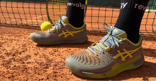 A photo of tennis shoes with Revolgy socks